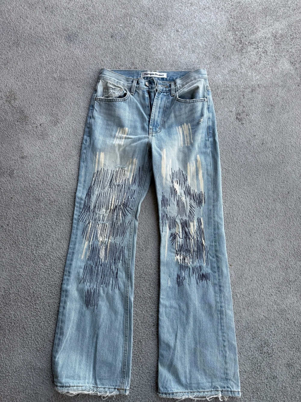 The open product Light Blue Flared Jeans with Embroidered Detail